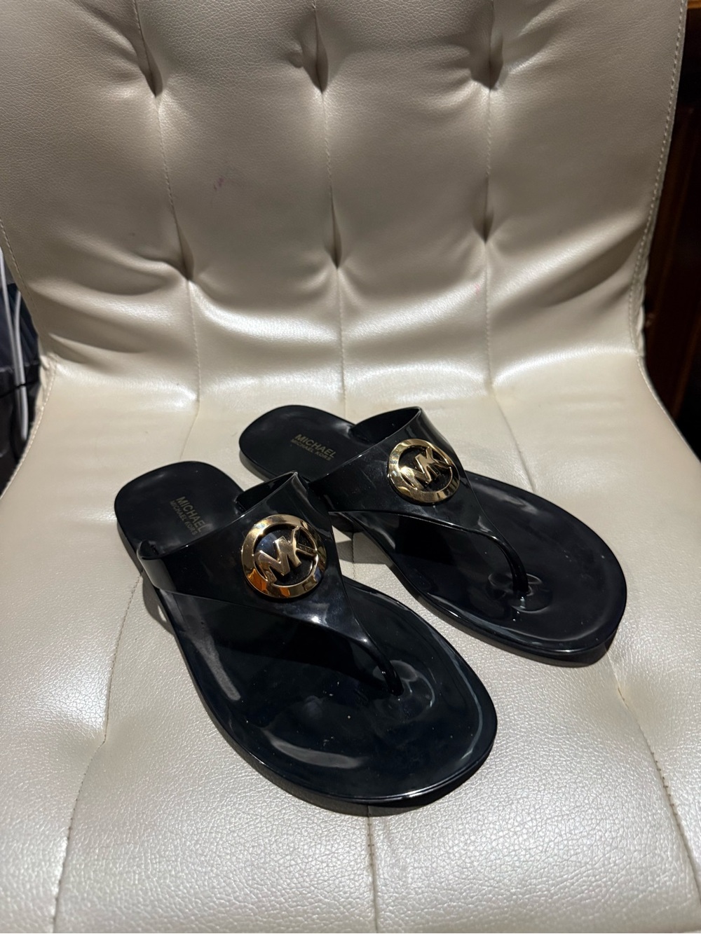 Michael Kors Black Thong Sandals with Gold MK Medallion